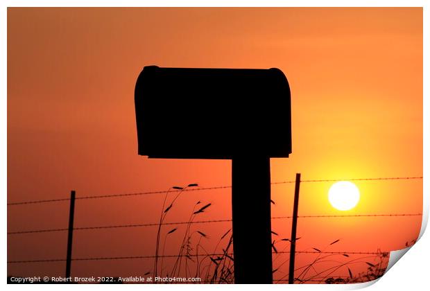 Mailbox silhouette at sunset with orange sky Print by Robert Brozek