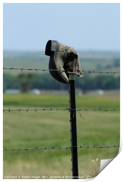 Cowboy boot on a fence with grass Print by Robert Brozek