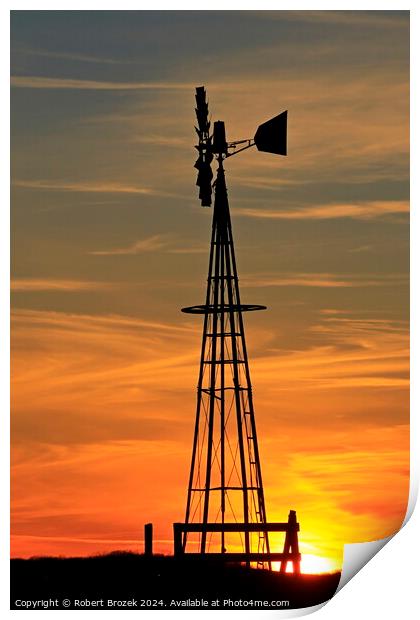 Kansas Golden Sky with clouds with a Farm Windmill silhouette Print by Robert Brozek