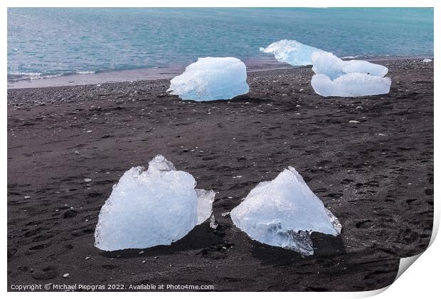 Diamond Beach in Iceland with blue icebergs melting on black san Print by Michael Piepgras