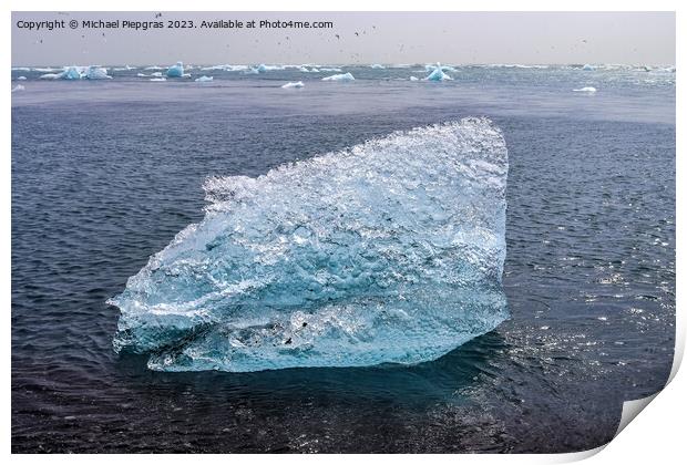 Diamond Beach in Iceland with blue icebergs melting on black san Print by Michael Piepgras