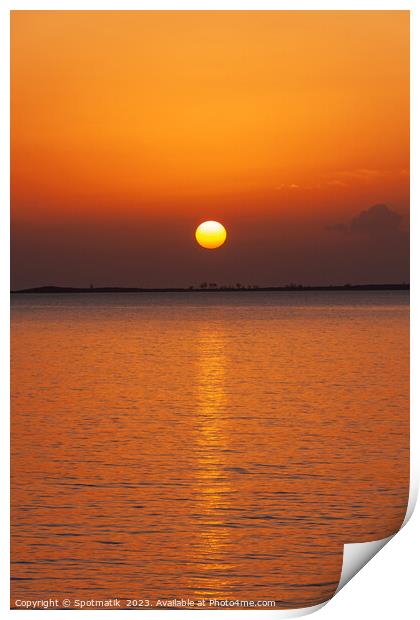 Orange sky with sunset reflection on tropical ocean Print by Spotmatik 