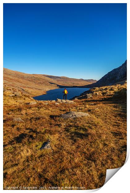 Lake in rural landscape with female backpacker Snowdonia Print by Spotmatik 