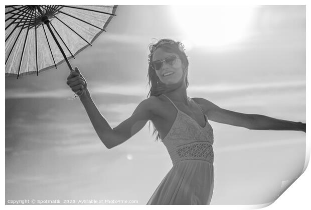 Young American female dancing on beach with parasol Print by Spotmatik 