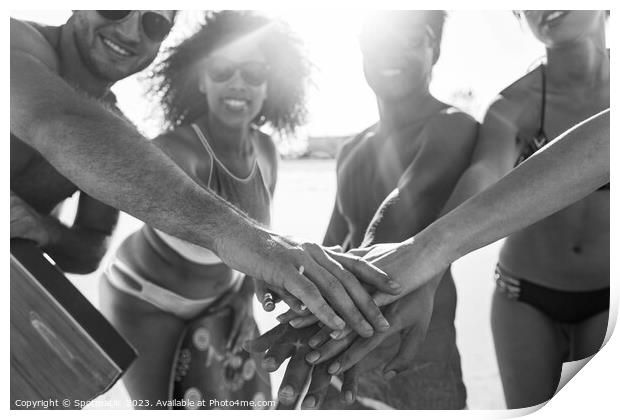 Friends in swimwear joining hands on beach vacation Print by Spotmatik 
