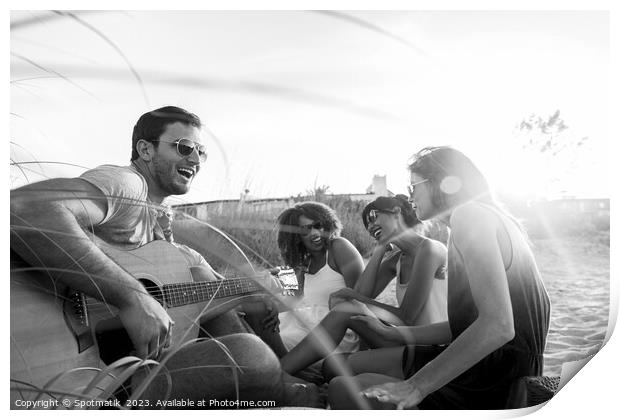 Young friends enjoying guitar music on beach vacation Print by Spotmatik 