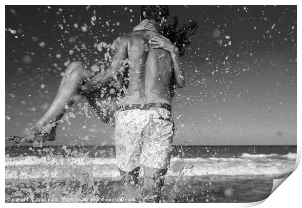 Fun loving ethnic couple running in ocean waves Print by Spotmatik 