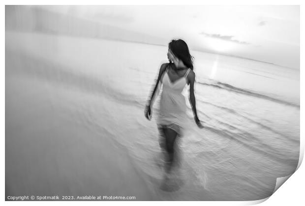 Motion blurred woman walking through waves at sunset Print by Spotmatik 
