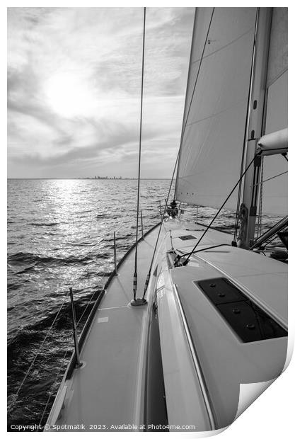 Luxury yacht sailing towards distant horizon at sunset Print by Spotmatik 