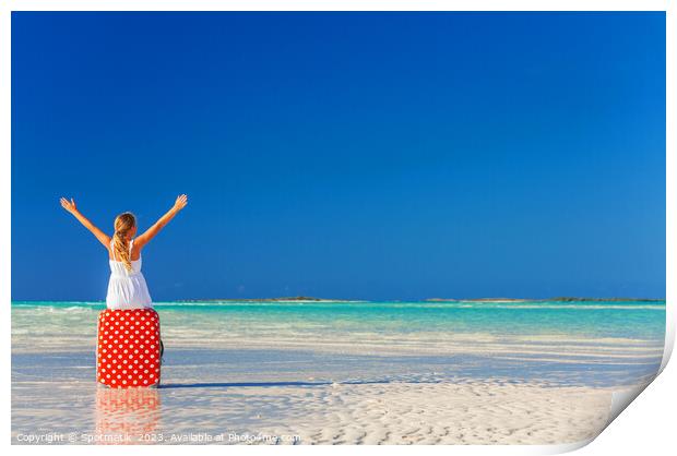 Blonde girl having beach fun sitting on suitcase Print by Spotmatik 