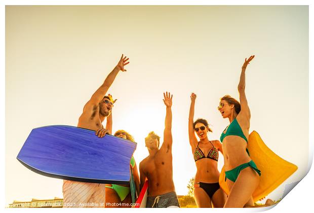 Friends in swimwear with bodyboards celebrating Summer vacation Print by Spotmatik 