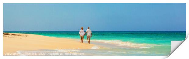 Panoramic view mature couple walking on beach Bahamas Print by Spotmatik 