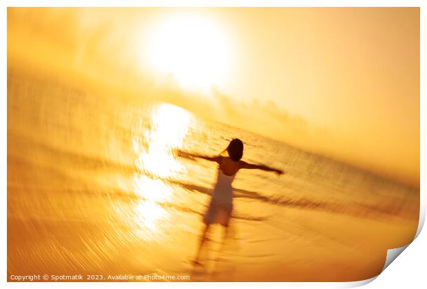 Motion blur Asian woman walking in ocean waves Print by Spotmatik 