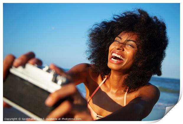 Afro girl laughing at camera taking fun selfie Print by Spotmatik 