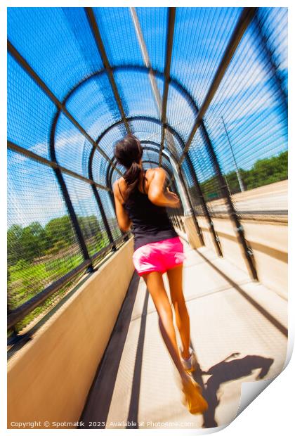 Young African American female jogging along arched walkway Print by Spotmatik 