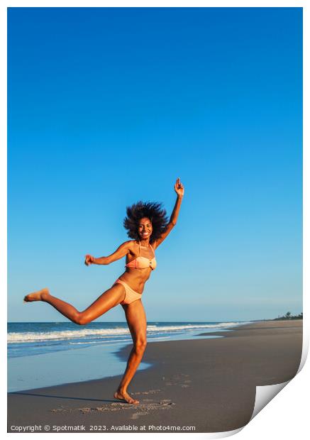 Playful young Afro American woman by the ocean Print by Spotmatik 