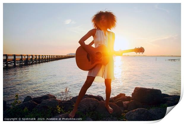 Afro American girl playing guitar with ocean sunset Print by Spotmatik 