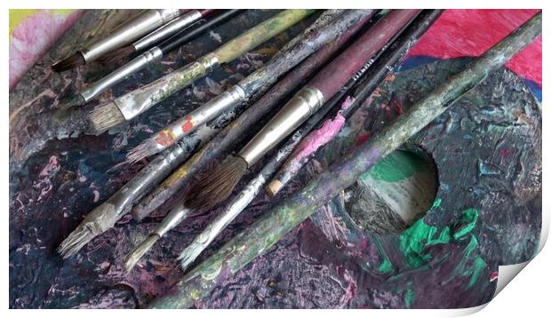 Used brushes on an artist's palette of colorful oil paint Print by Irena Chlubna