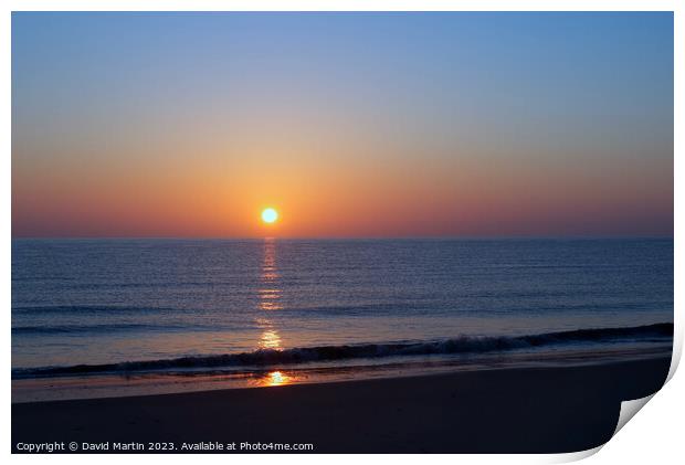 Sunrise over the sea Print by David Martin