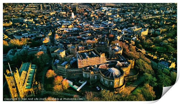 Aerial view of a historic Lancaster castle amidst a sprawling cityscape during golden hour, showcasing architectural beauty and urban density. Print by Man And Life