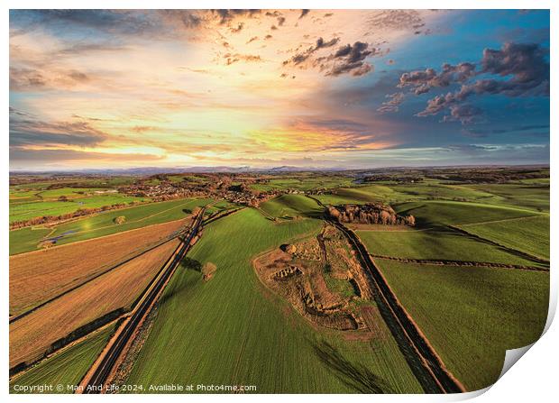 Aerial view of a lush countryside at sunset with vibrant skies and patchwork fields. Print by Man And Life