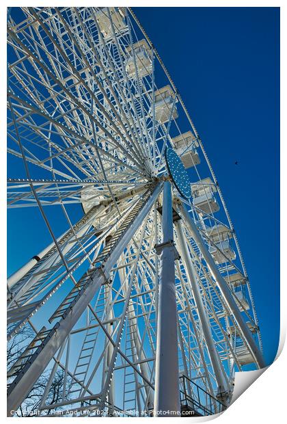 Low-angle view of a Ferris wheel against a clear blue sky in Lancaster. Print by Man And Life