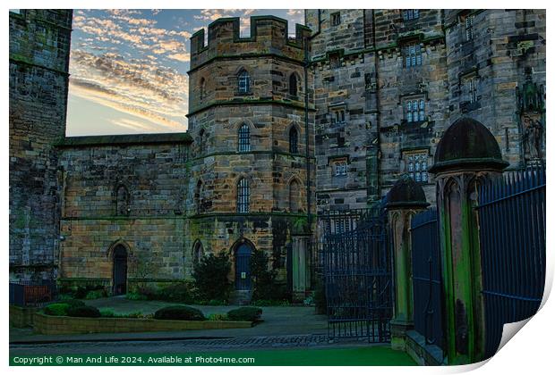 Historic stone castle at dusk with dramatic sky and greenery, suitable for travel and history themes in Lancaster. Print by Man And Life