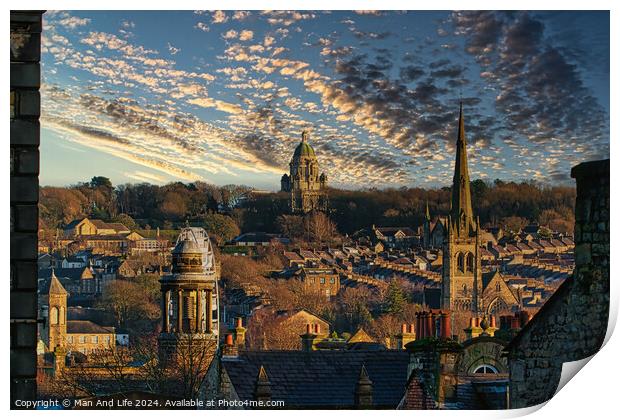Historic cityscape at sunset with dramatic clouds, showcasing architectural landmarks and a warm golden light bathing the buildings in Lancaster. Print by Man And Life