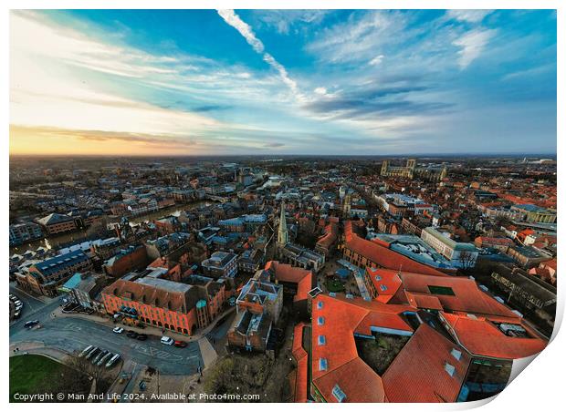 Aerial view of a European city at dusk with historic buildings and a dramatic sky in York, North Yorkshire Print by Man And Life