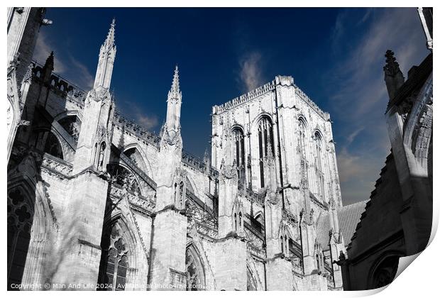 Gothic cathedral architecture with spires against a blue sky with clouds in York, UK. Print by Man And Life