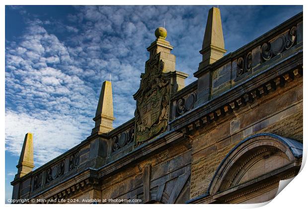 Historic building facade with ornate sculptures against a blue sky with clouds in Harrogate, England. Print by Man And Life