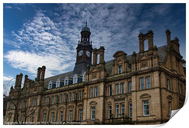 Historic European architecture with a clock tower under a dramatic cloudy sky in Leeds, UK. Print by Man And Life
