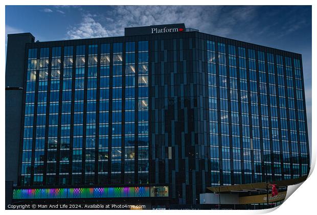 Modern office building facade with reflective glass windows against a clear blue sky in Leeds, UK. Print by Man And Life