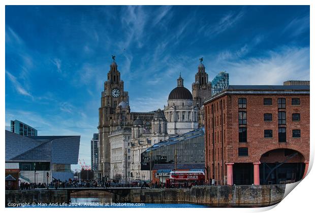 Liverpool waterfront with historic buildings and blue sky Print by Man And Life