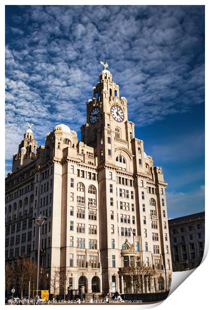 Historic clock tower building against a blue sky with clouds in Liverpool, UK. Print by Man And Life