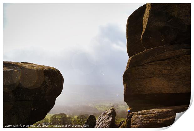 Scenic view of a landscape through rock formations under a cloudy sky at Brimham Rocks, in North Yorkshire Print by Man And Life