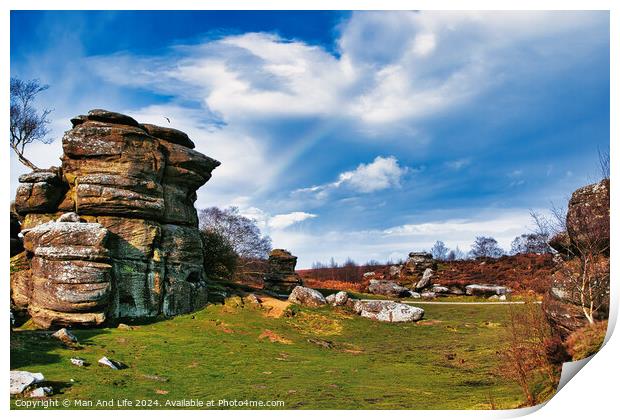 Scenic view of rock formations and lush greenery under a blue sky with wispy clouds at Brimham Rocks, in North Yorkshire Print by Man And Life