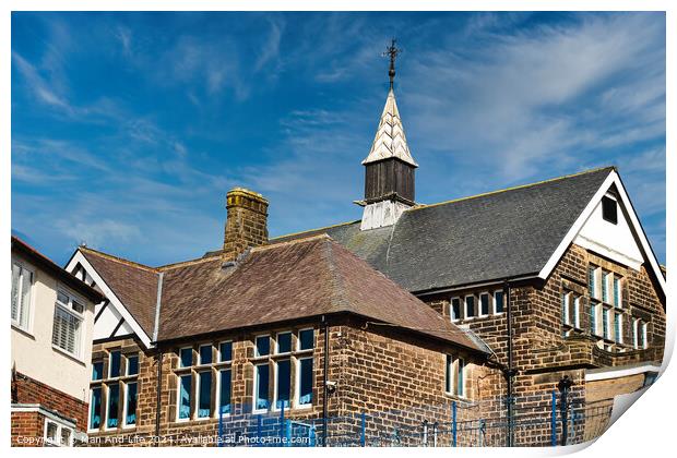 Traditional brick school building with a spire against a blue sky with wispy clouds in Harrogate, North Yorkshire. Print by Man And Life