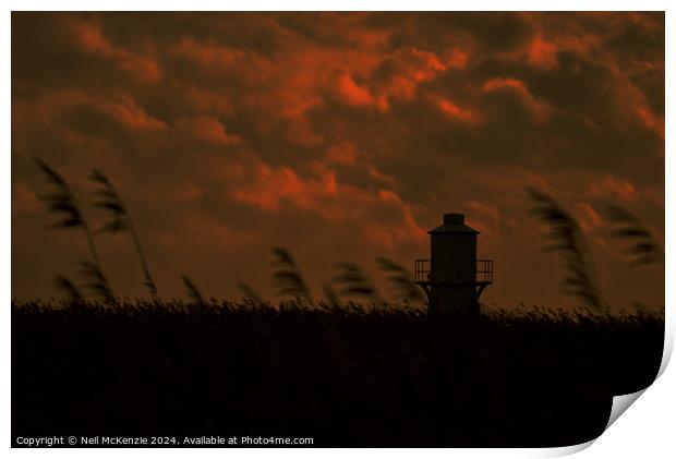 Lighthouse under a cloudy sky  Print by Neil McKenzie