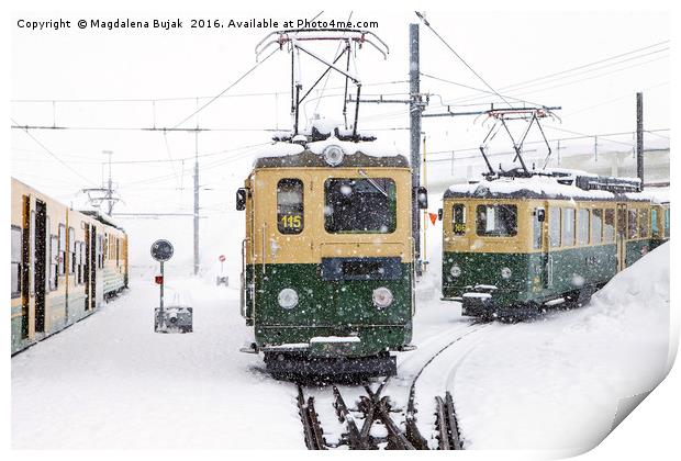 Trains in heavy snow at Kleine Scheidegg station Print by Magdalena Bujak