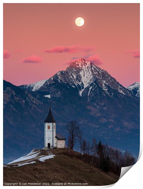 Full moon rising over Jamnik church and Storzic at sunset Print by Ian Middleton