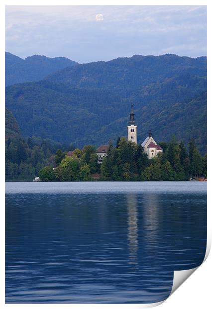 Moon setting at sunrise over Lake Bled Print by Ian Middleton