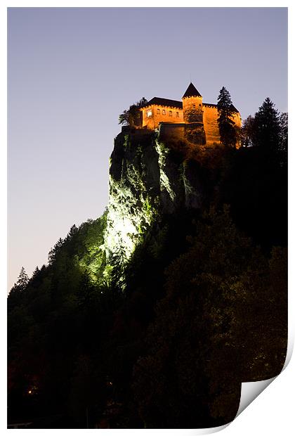 Bled castle lit up at night Print by Ian Middleton