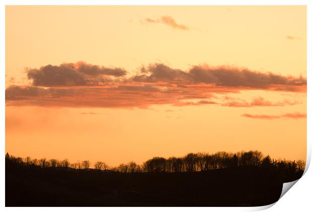 Wispy clouds at sunset Print by Ian Middleton