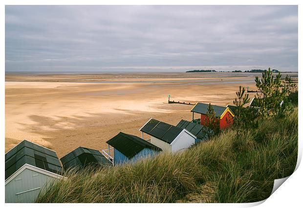 Beach huts and sunlit view out to sea. Print by Liam Grant