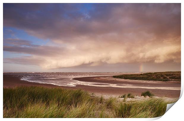Storm clouds and rainbow at sunset. Holkham, Norfo Print by Liam Grant