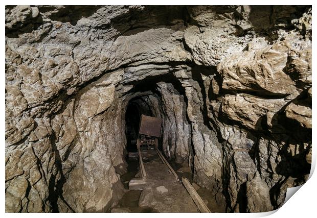 Mine cart in an old abandoned mine cave. Near Matl Print by Liam Grant