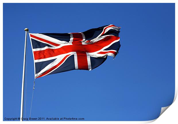 Union Jack on blue sky Print by Craig Brown