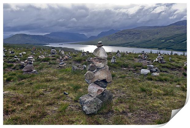 Odd cairns beside the A87 Print by Gary Eason