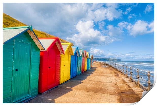 Vibrant Beach Huts Adorning Whitby Beachfront Print by Derek Beattie